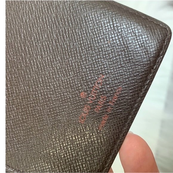 100% authentic Louis Vuitton Damier Ebene (DE) long vertical wallet organizer. - Picture 10 of 15
